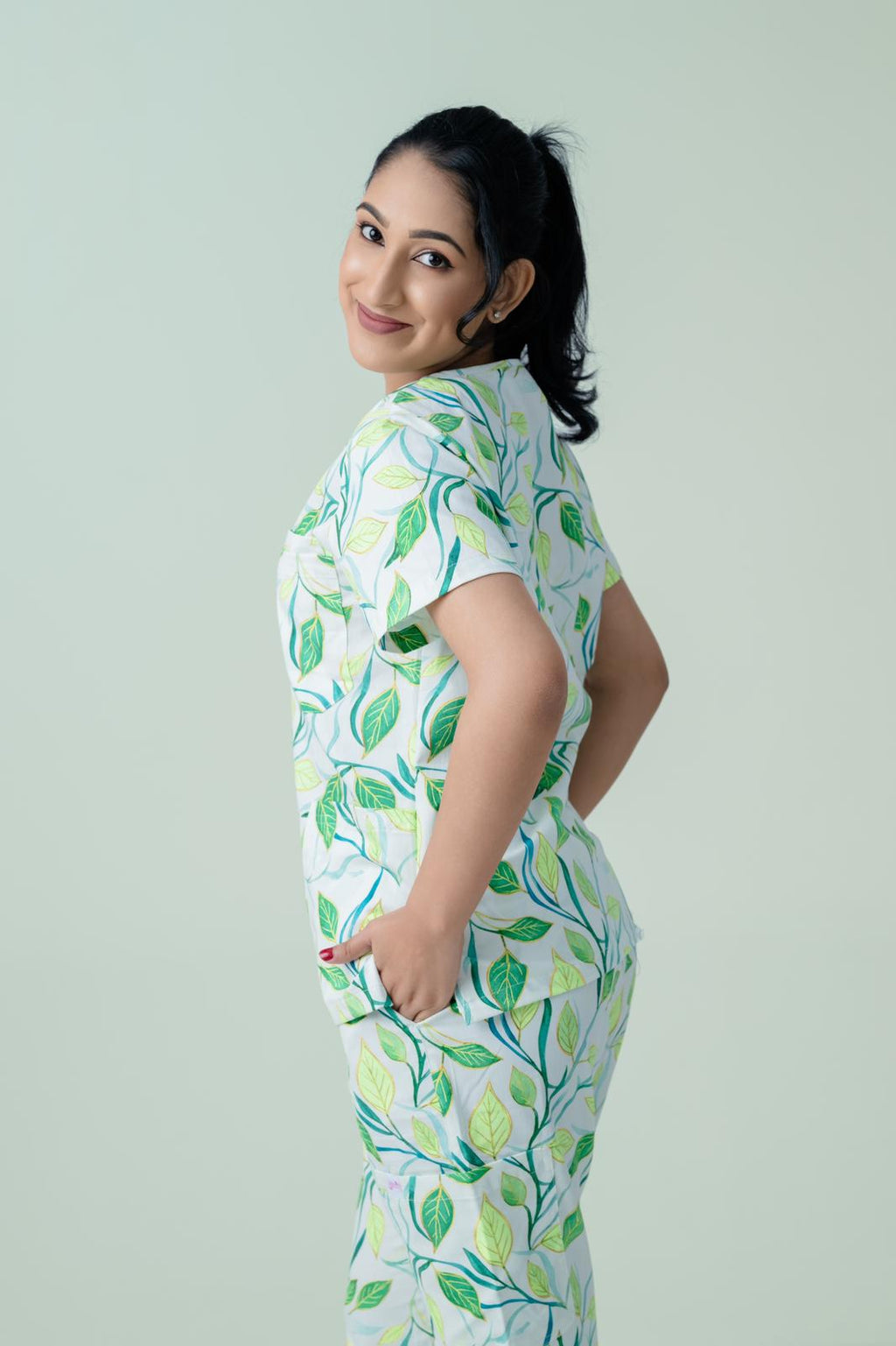 Side view of botanical print medical scrub top for healthcare professionals