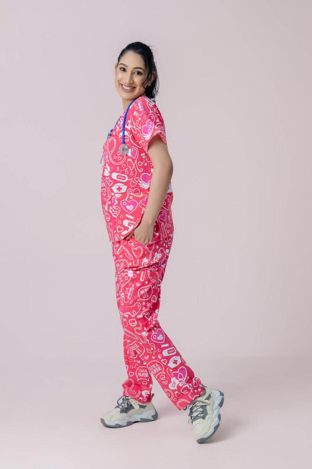 Female medical professional wearing stylish pink scrub uniform