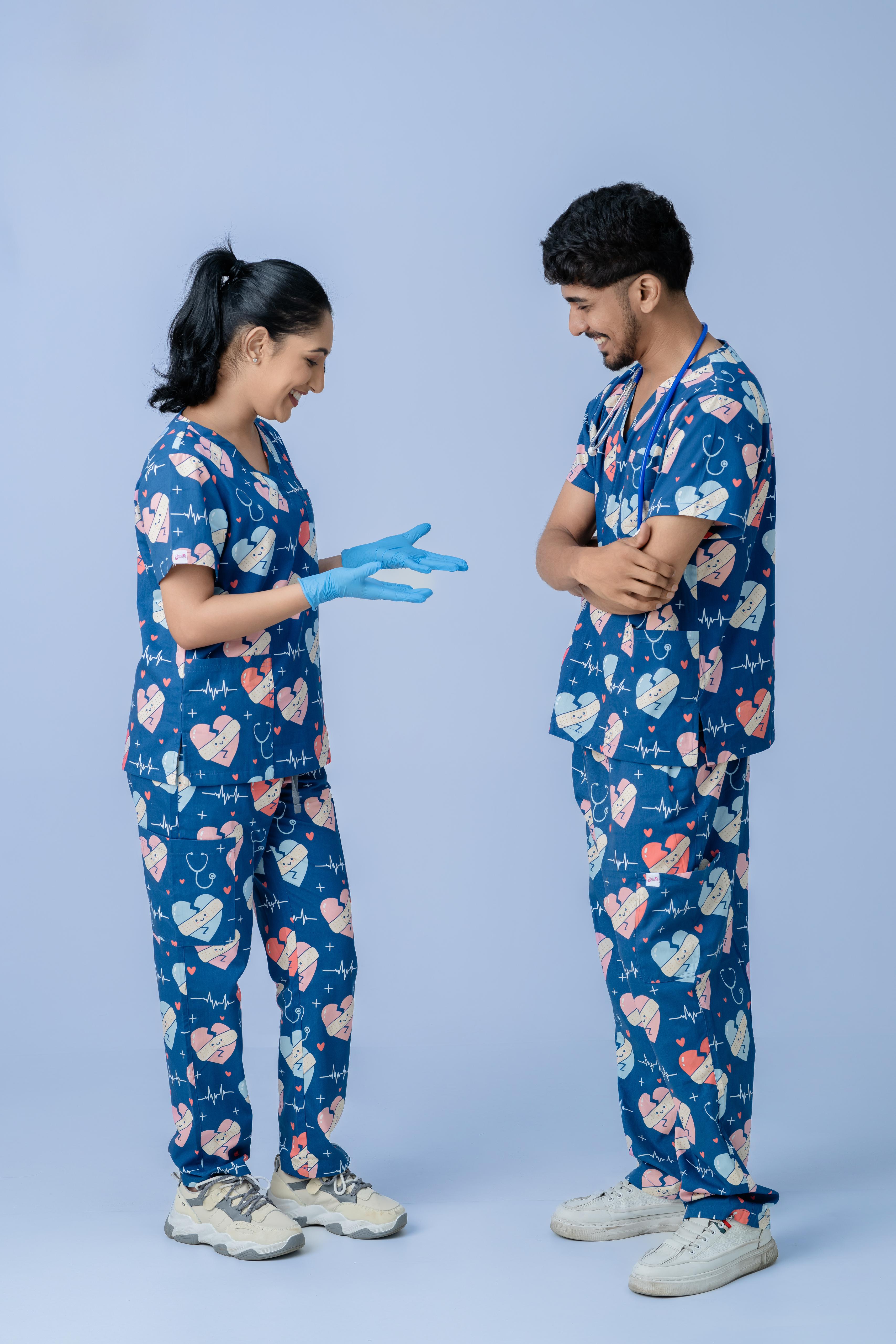 Healthcare professionals in blue heart print medical scrubs standing together