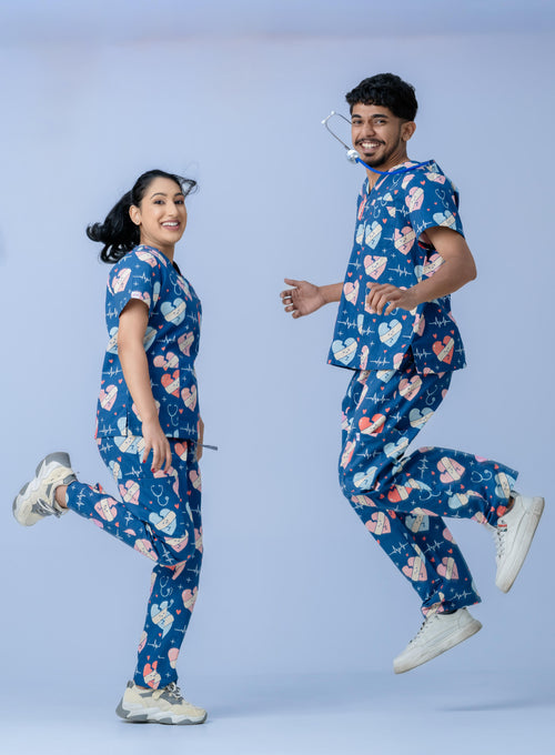 Nurses wearing stylish navy blue scrub uniforms with heart print design